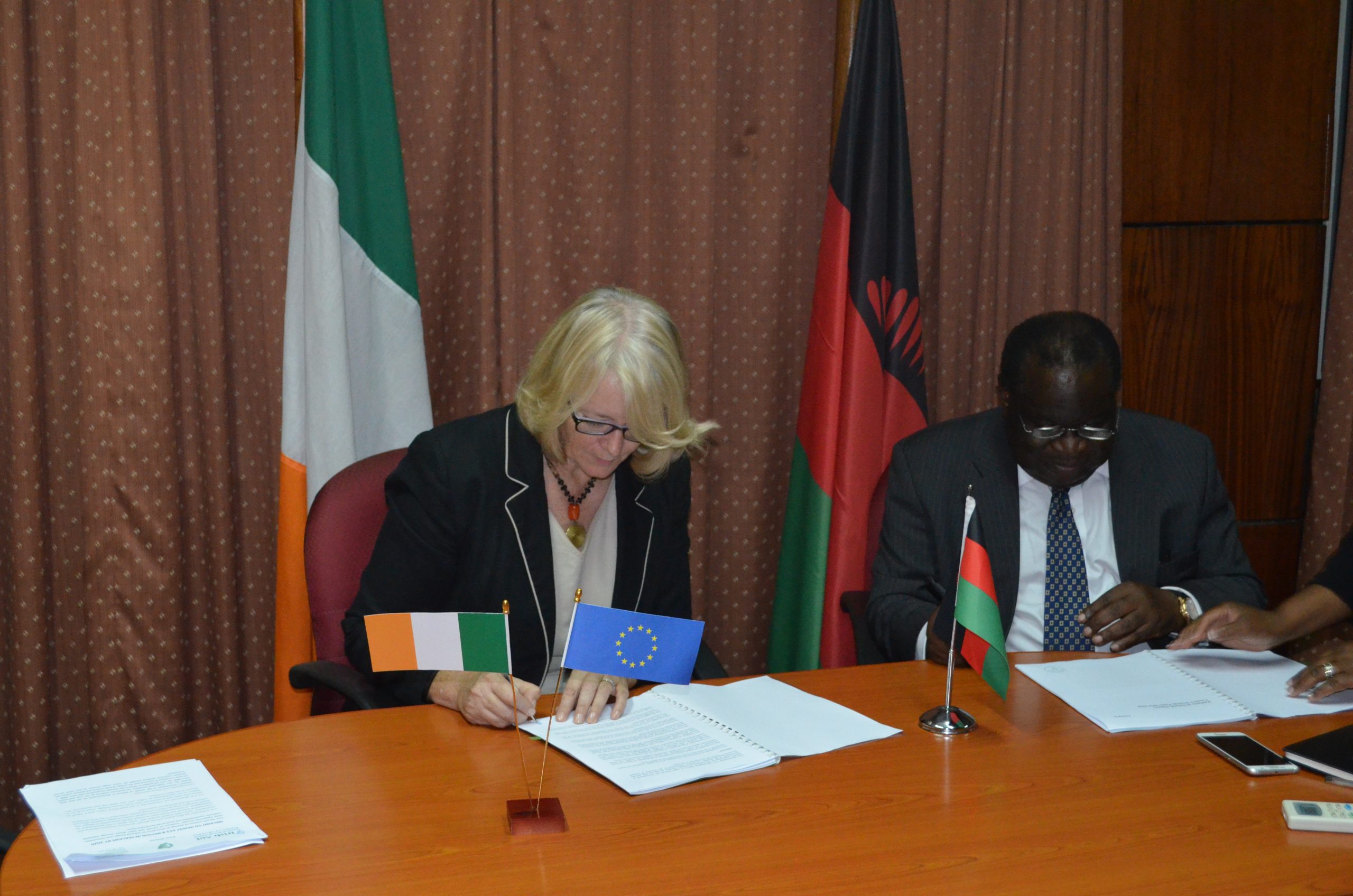 Signing of Memorandum of Understanding between Government of Ireland and Government of Malawi by Goodall Gondwe, Minister for Finance and Ambassador Áine Hearns in 2016.