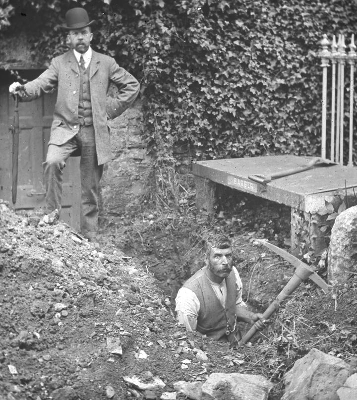 A man stands over the excavated grave while a labourer stops his work for the photograph. Image courtesy of the Representative Church Body Library from ‘Digging for Emmet: Ghostly images from Dublin’s past brought back to life through digitization’ by Bryan Whelan.